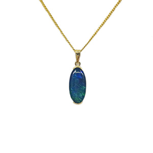 9ct yellow gold pendant with a vibrant bezel-set triplet opal, exhibiting a rich play of blue and green hues. | Fremantle Opals