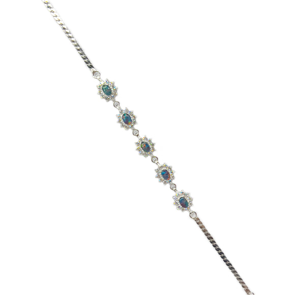 A sterling silver bracelet featuring a row of oval triplet opal stones, each surrounded by cubic zirconia accents, capturing the allure of classic elegance. | Fremantle Opals