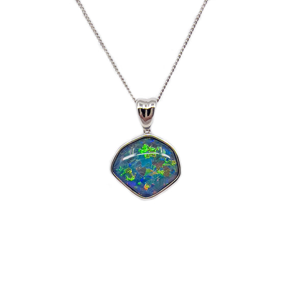 A sterling silver pendant with a vibrant Australian triplet opal at the center, surrounded by a polished frame. The opal shows a brilliant array of green and blue colors, reminiscent of a tropical sea. Above the opal, a small, shiny cubic zirconia adds a touch of sparkle to the piece. The pendant hangs on a delicate silver plated chain, which is included for display. | Fremantle Opals