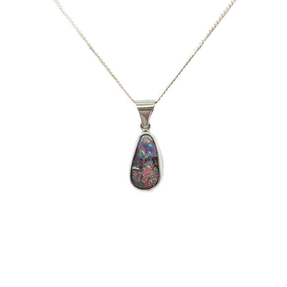 A luxurious 18ct white gold pendant with a 5.01ct vibrant Australian boulder opal, bezel-set, accompanied by a complimentary silver-plated chain, displaying a kaleidoscope of colors. | Fremantle Opals