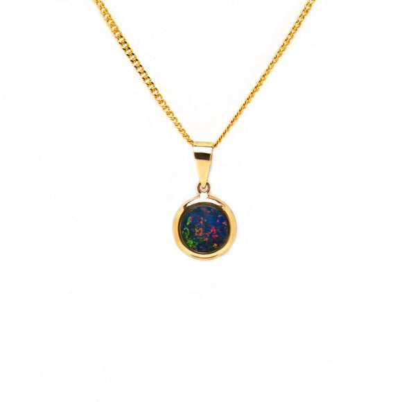 Dainty 14ct yellow gold pendant featuring a round-cut Australian doublet opal with a captivating play colour and bezel-set. | Fremantle Opals