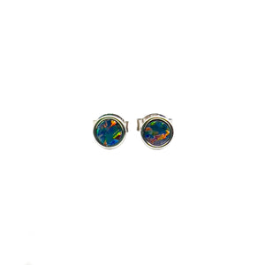 Round sterling silver stud earrings with rhodium plating, showcasing vibrant doublet opals in a bezel setting, featuring rich blues, greens, and hints of fiery red. | Fremantle Opals