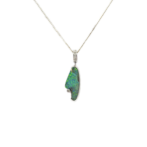 A 14ct white gold pendant showcasing a 3.78ct boulder opal with a vivid play-of-color in green and blue hues, accented with sparkling diamonds, on a complimentary display chain. | Fremantle Opals