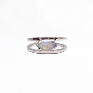 Sterling silver ring featuring a solid Australian light opal with a subtle play of blue and green hues, set in a simple and elegant claw set design. | Fremantle Opals