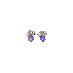 Tiny sterling silver stud earrings featuring oval-cut black opals with a captivating play of purple and blue hues | Fremantle Opals