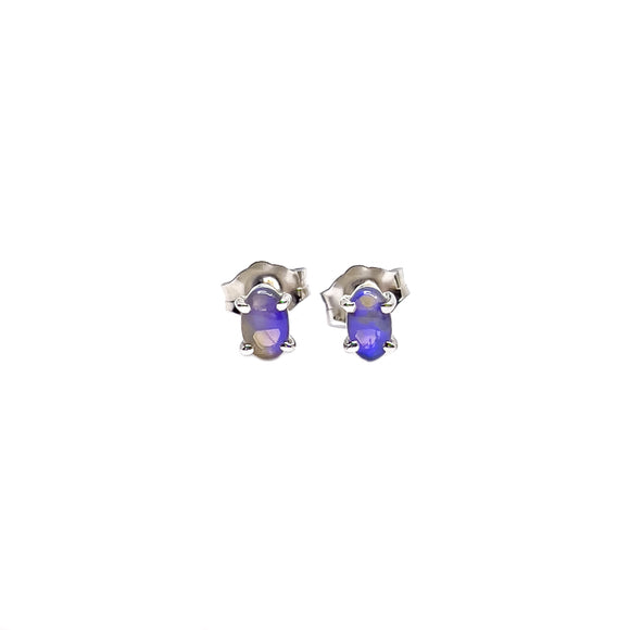 Tiny sterling silver stud earrings featuring oval-cut black opals with a captivating play of purple and blue hues | Fremantle Opals