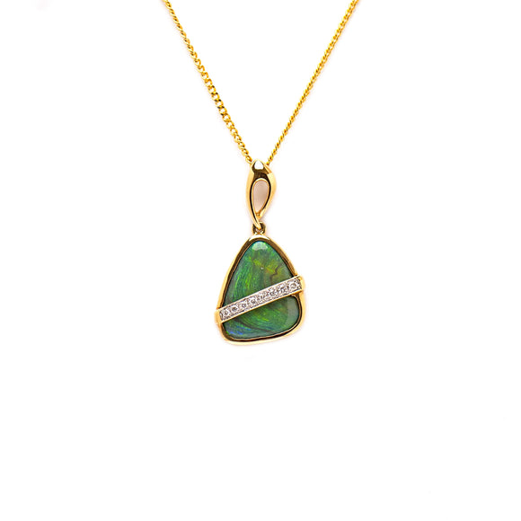 An 18ct yellow gold pendant showcasing a 2.32ct triangular black opal with a diagonal stripe of diamonds, creating a harmonious balance of rich color and sparkling light | Fremantle Opals