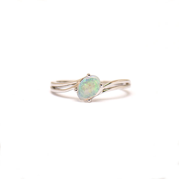 Sterling silver ring with a luminous light opal centerpiece, set within a sleek, flowing band design. | Fremantle Opals