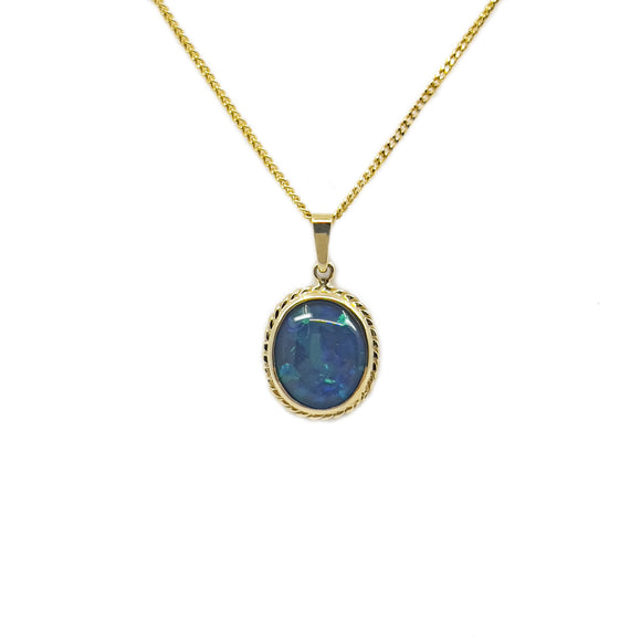 An oval triplet opal pendant with a vibrant blue-green hue, bezel-set in 9ct yellow gold. | Fremantle Opals