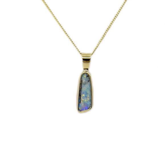 A 9ct yellow gold pendant with a vibrant, bezel-set Australian boulder opal showing a kaleidoscope of colours. | Fremantle Opals