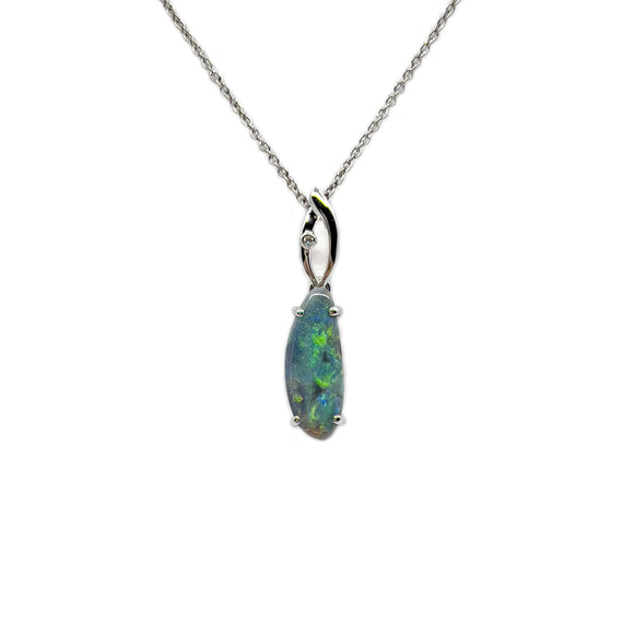 A sophisticated 18ct white gold pendant showcasing a claw-set Lightning Ridge black opal, emitting a vibrant green and blue sheen, accented with a single diamond. | Fremantle Opals