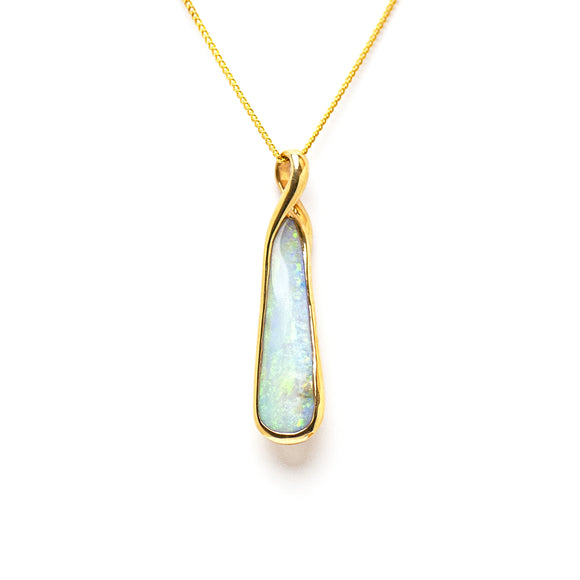 14ct yellow gold pendant featuring a bezel-set Boulder opal with a spectrum of iridescent colors. | Fremantle Opals