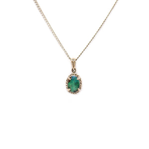 9ct white gold pendant with a vibrant green Boulder opal, set in a classic halo design | Fremantle Opals